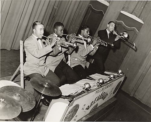 Will Hitchcock playing the trombone and three trumpet players from his Dreamband playing at the Harlem Casino