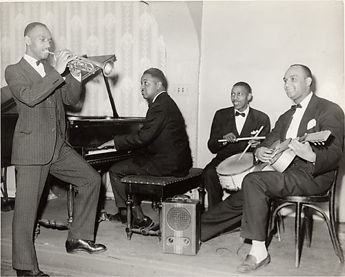 Four piece jazz band including John Anderson on trumpet and Thedus Birch on guitar