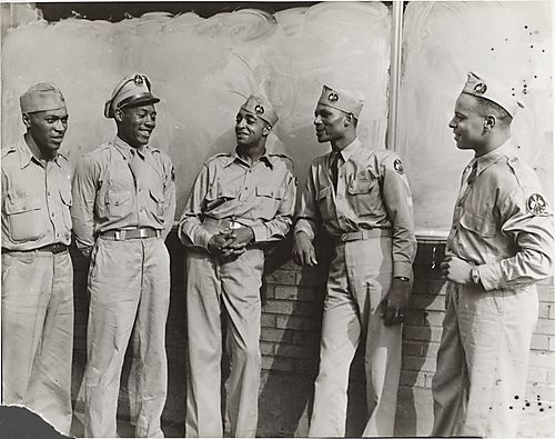 Five soldiers in khaki uniforms
