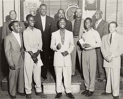 Members of the city's sanitation workers' union, including Andy Goodson and Bill Miller, with three young men holding certificates