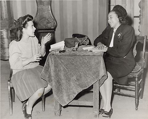 Two women rehearsing a play