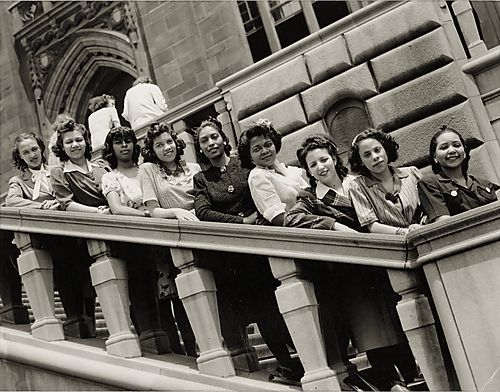 Nine women standing on side entrance to the Cathedral of Learning, University of Pittsburgh