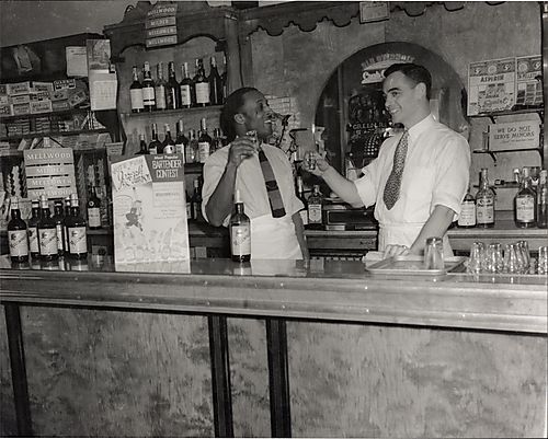 The manager toasting the bartender at Rosens Music Bar on Liberty Avenue