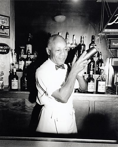 Bartender shaking drink