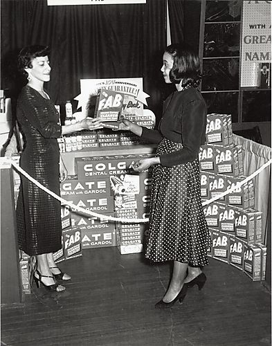 Trade show at Syria Mosque in Oakland: women at Fab and Colgate promotional display