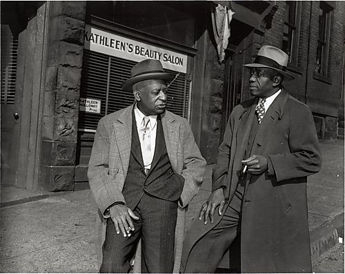 City detective and politician Walter C. Rainey and another man in front of Kathleen's Beauty Salon