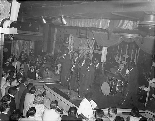 Seven piece jazz band performing at the Rock 'n Roll Club, with Christmas decorations