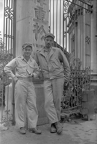 Harold Corsini and Soldier Standing Near Gate