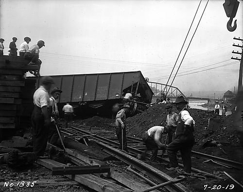 Men Cleaning up the Wreck