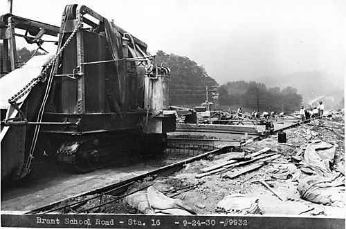 Laborers pouring concrete at Brandt School Road
