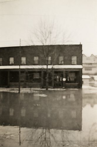 Reed's Apartments Reflected by Flood Waters