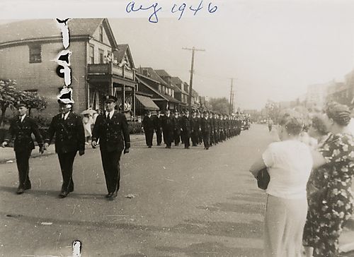 Women Observe Parade of Military Men