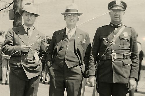 Police Officer and Mayor Pose for a Photograph