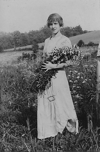 Young woman with wild flowers