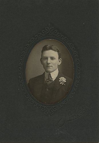 Portrait of a young man with a boutonniere
