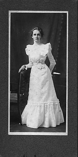 Portrait of a young woman in a white dress