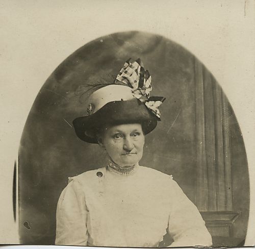 Postcard photograph of an older woman wearing a hat