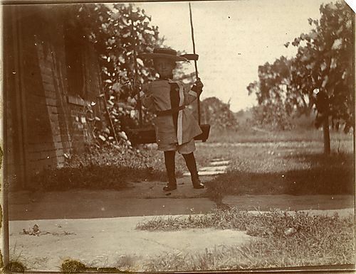 Child in a boater hat