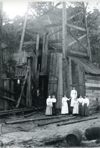 Denny Family in Front of Oil Derrick