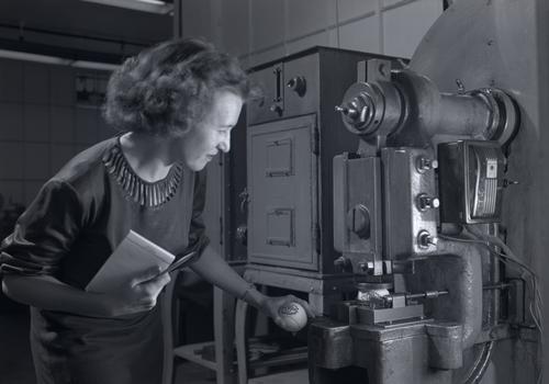 Pennsylvania Rubber Company employee testing a tennis ball