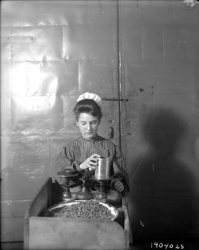 Woman Weighing Beans