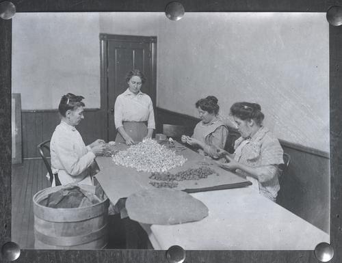 Women wrapping chocolate
