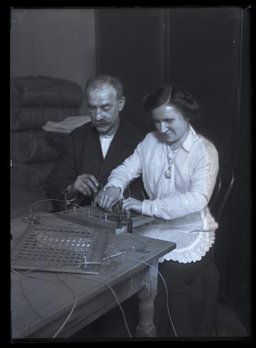 A blind man and woman caning a chair seat