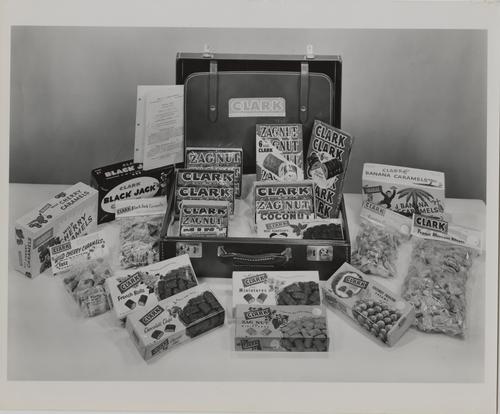 Various D. L. Clark Company products with salesperson suitcase
