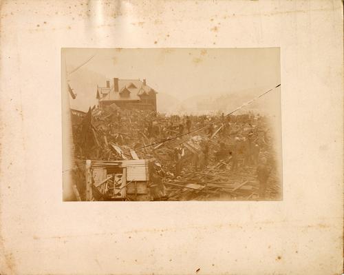 Workers Cleaning Rubble from Destroyed Buildings