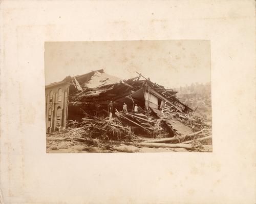 Men Standing in Destroyed Building