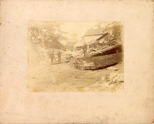 Men near Flood debris and B&O Railroad Car