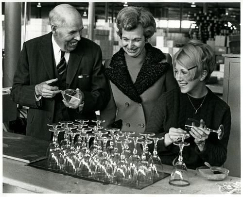 Visitors to Lenox’s crystal plant watch Betty Hann band glass for etching