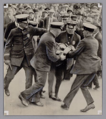 Police Arresting a Communist Parader
