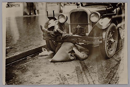 A Communist Dropped Over a Car's Fender