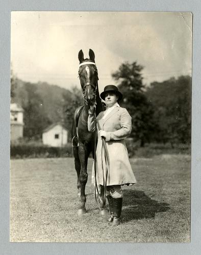 Mary Roberts Rinehart with saddle horse