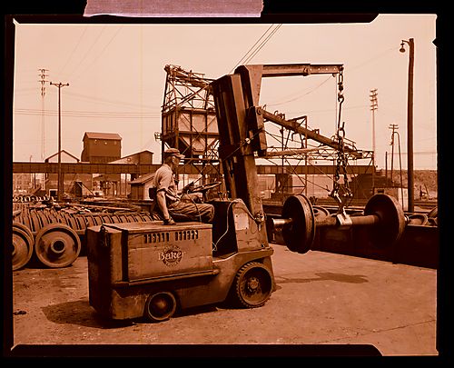 Man Lifting Wheels