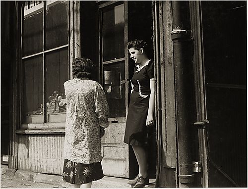 (Neighborhoods: Two Women Talking in Doorway)