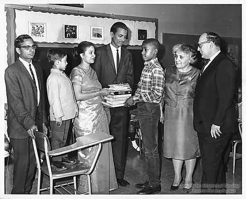 India Association members present books to A. Leo Weil School Library