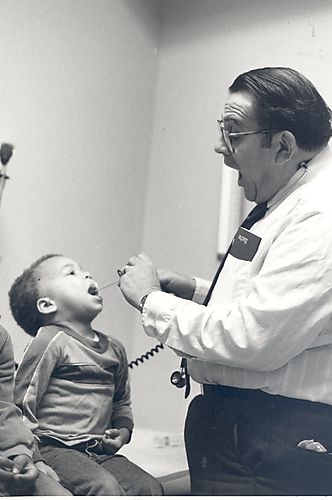 Dr. Jerome Wolfson examines a child.
