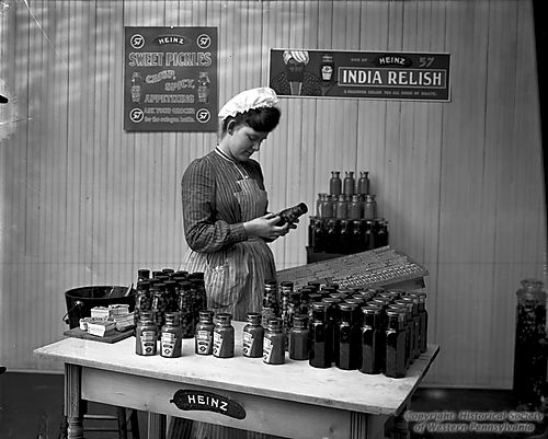 Labeling Bottles of Mustard in Studio