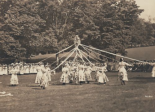 Maypole dance on college lawn
