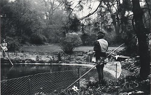 Snapshot of two students and Mellon Pond